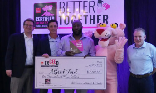 Alfred Ford, "Installer of the Year" poses with prize check from Owens Corning®