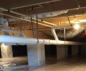 Protected pipes in a crawl space