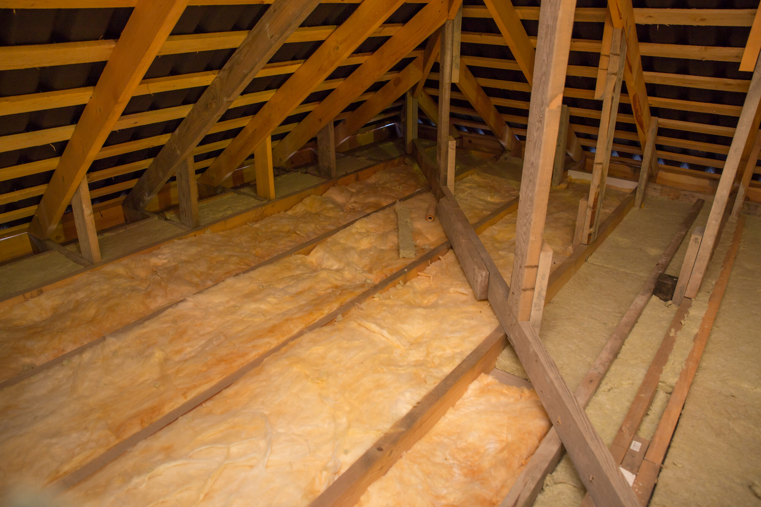 Fiberglass insulation in an attic